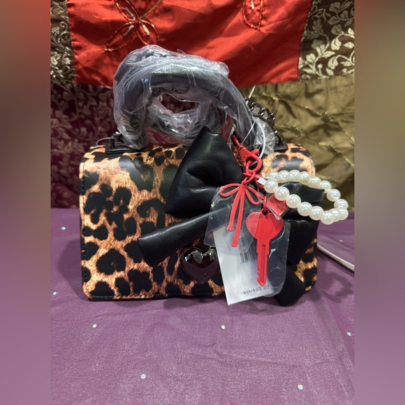 Betsey Johnson Handbags - Betsey Johnson Leopard Print Handbag with Black Bow and Red Accents